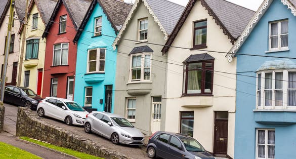 photo of view of Row home and cathedral in Cobh, Ireland.