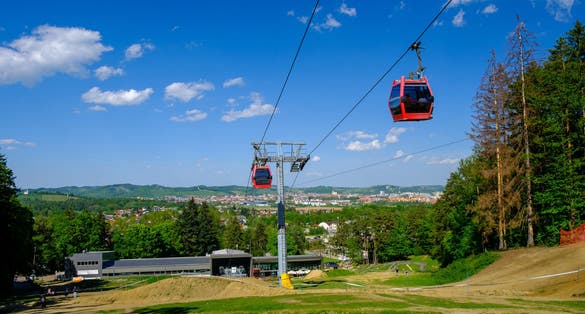 Overhead cable cars at lower station of cableway on Pohorje in Maribor, Slovenia, Mariborsko Pohorje ski slopes are popular hiking destination in summer
