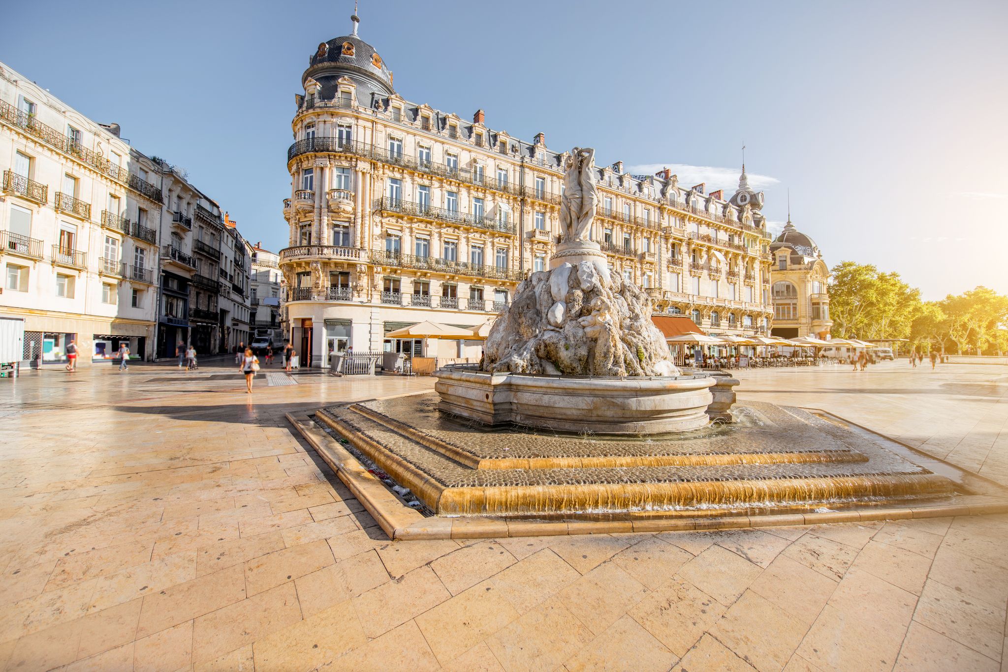photo of the Comedy square with fountain of Three Graces during the morning light in Montpellier city in southern France.