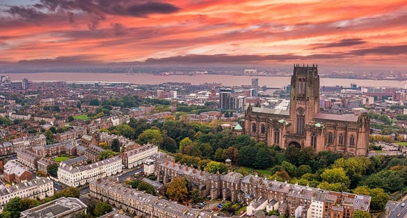phot of view of Beautiful sunset view of theLiverpool cathedral in Liverpool, UK.