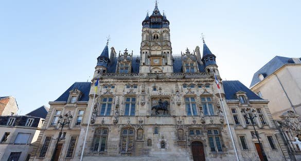 Photo of the town Hall of Compiegne has an elegant architecture typical of the flamboyant gothic style of the 16th century, France.