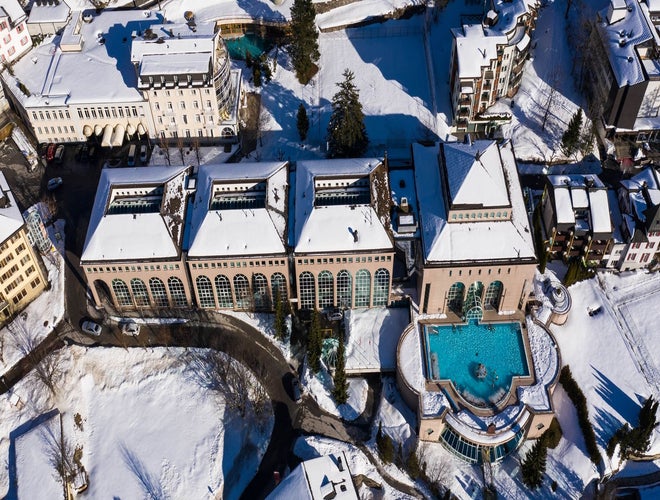 Aerial view of the thermal spa resort in Leukerbad, Switzerland, surrounded by snow in winter..jpg
