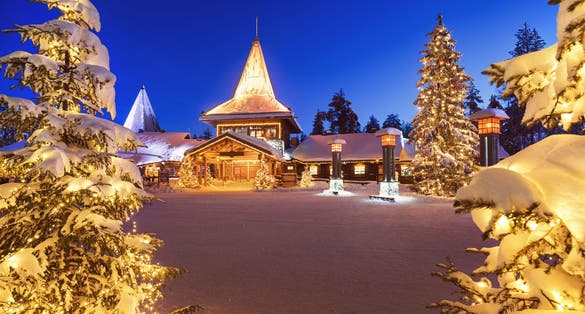 Photo of winter night view of Santa Claus Village in Rovaniemi in Lapland in Finland.