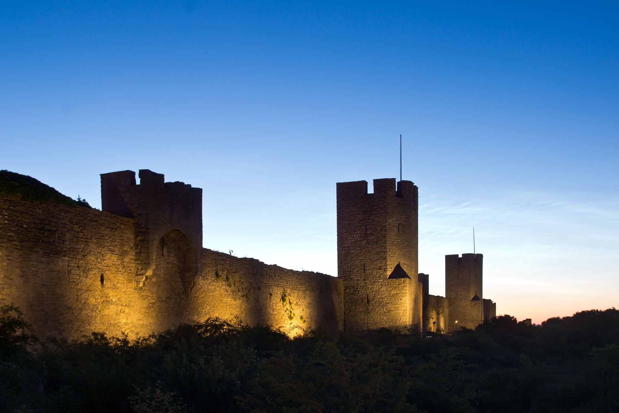 photo of city wall of Visby at night in Sweden.