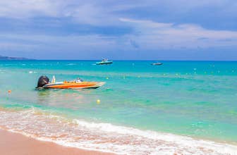 Photo of Faliraki beautiful Bay and beach with turquoise clear water, Rhodes, Greece.