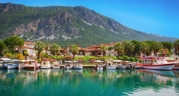 Photo of view on pier with boats and yachts, Marmaris pier, boats and yacht, Mediterranean sea, Turkey.