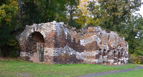 photo of view of Grotto in Autumn in the Park Neuer Garten, Potsdam, the Capital City of Brandenburg, Potsdam, Germany.