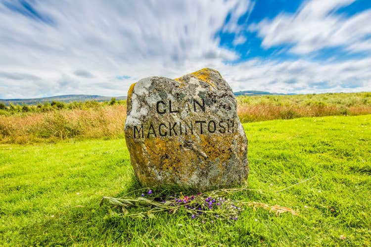 Clouds roll over a medieval gravestone for clan Mackintosh from the battle of Bannockburn.