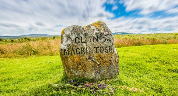 Clouds roll over a medieval gravestone for clan Mackintosh from the battle of Bannockburn.