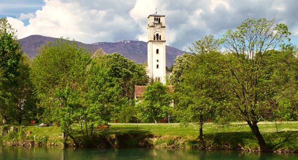 photo of The old clock tower Sahat Kula and mountain river Una in Bihac, Bosnia and Herzegovina.