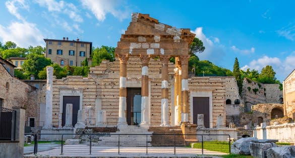photo of view of Roman ruins of Tempio Capitolino in Brescia, Italy. 