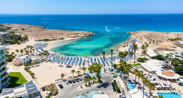 Photo of aerial bird's eye view of Vathia Gonia beach, Ayia Napa, Famagusta, Cyprus. Landmark tourist attraction rocky bay with golden sand.