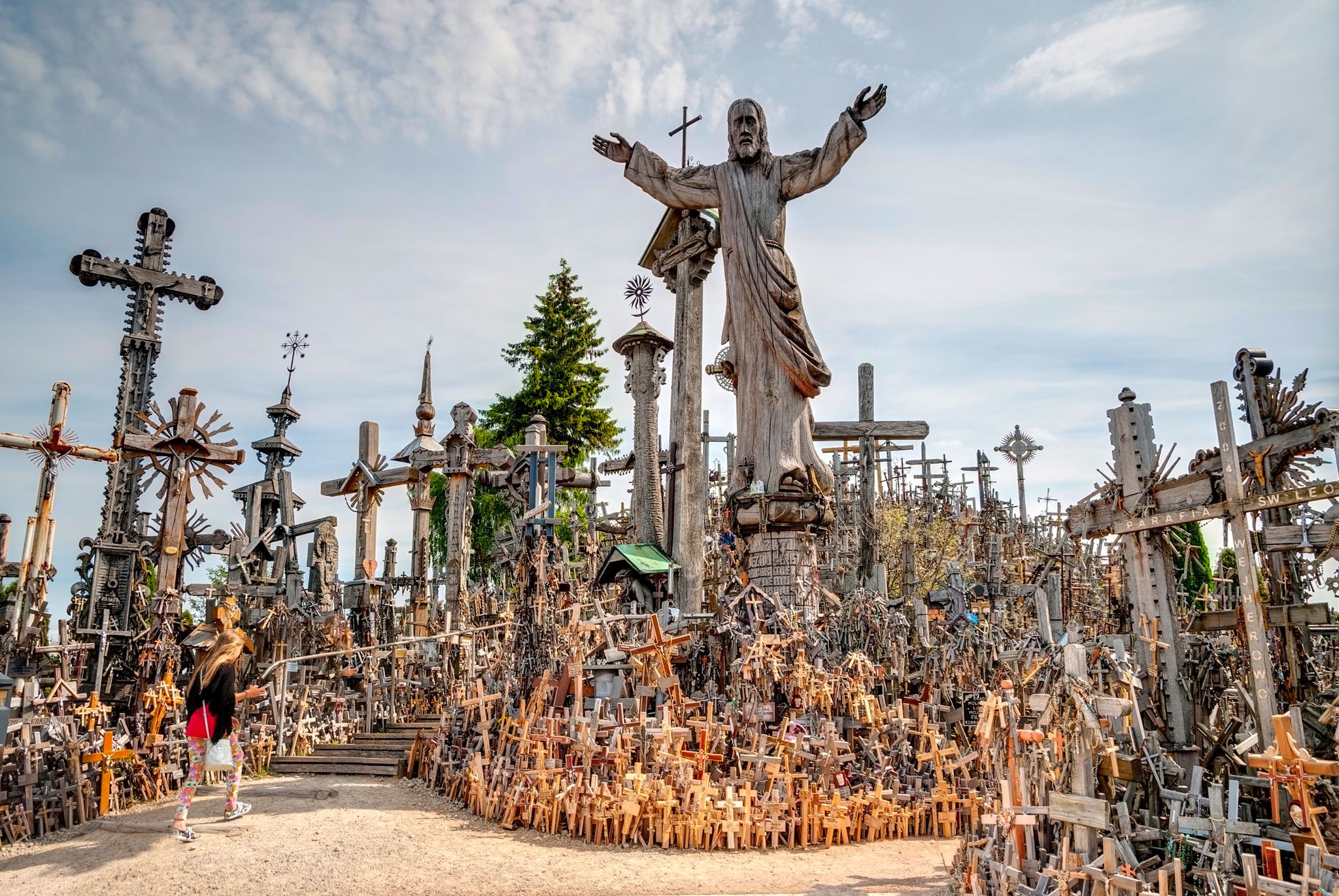 photo of Siauliai, Lithuania -July 18: Pilgrims visiting hill of crosses (kryziu kalnas) a famous religious landmark in Lithuania on July 18, 2015.