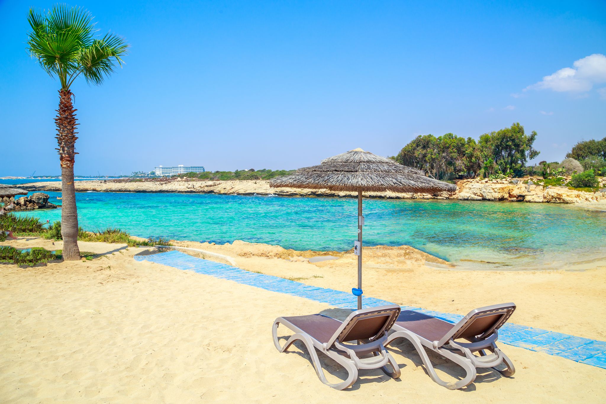 Photo of azzure water and beautiful Nissi beach in Aiya Napa, Cyprus.