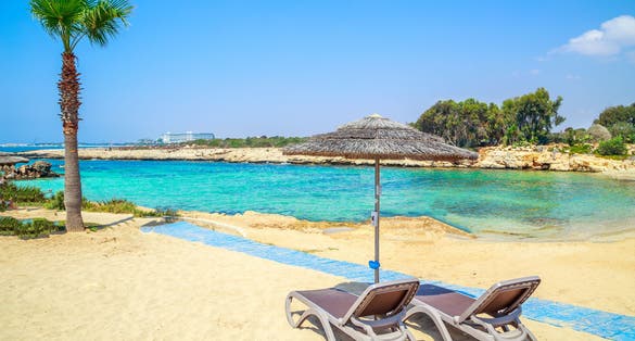 Photo of azzure water and beautiful Nissi beach in Aiya Napa, Cyprus.