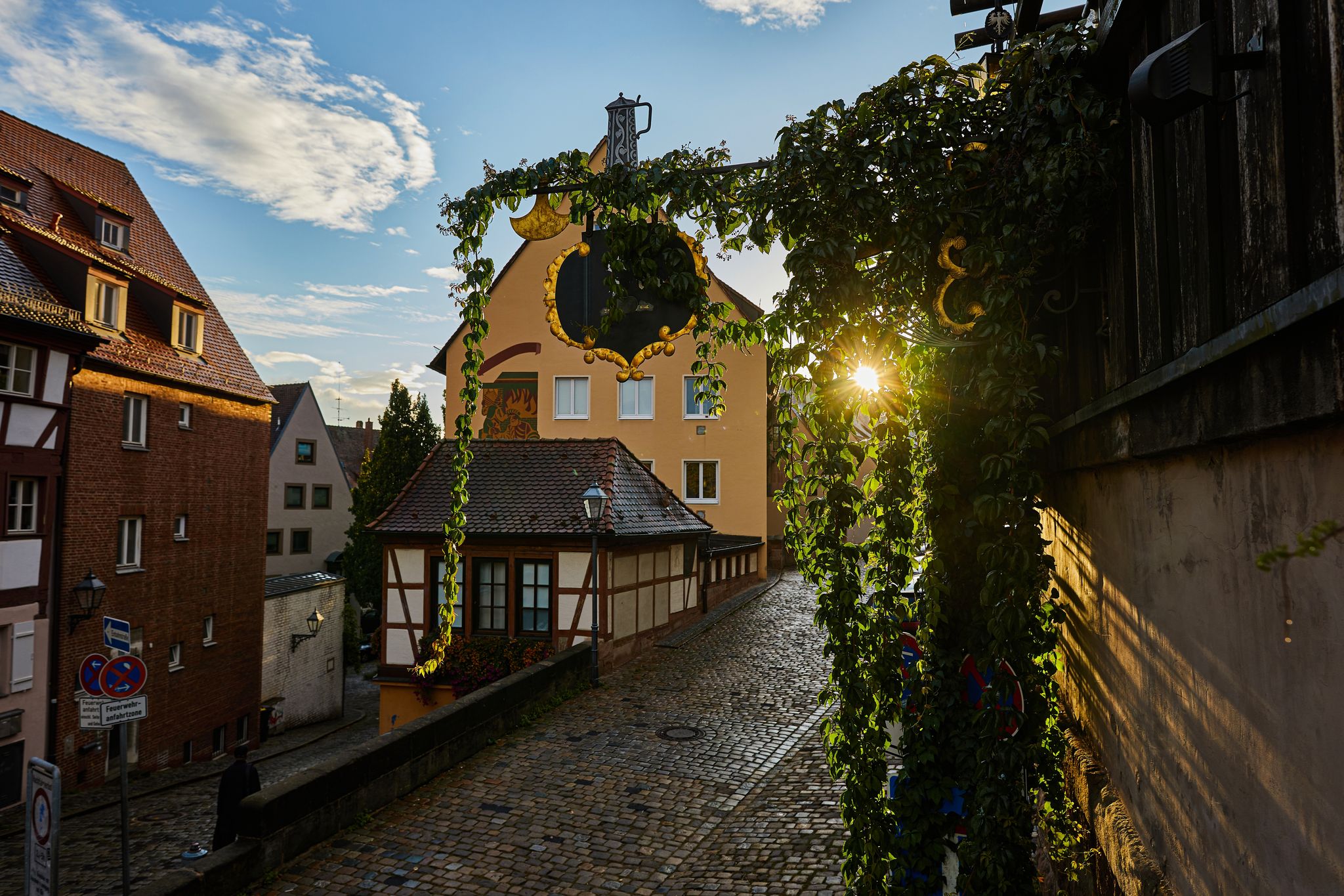 photo of Albrecht Dürer House German Renaissance art Altstadt Castle Kaiserburg Nuremberg's city in sunrise .