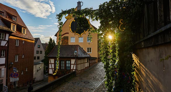 photo of Albrecht Dürer House German Renaissance art Altstadt Castle Kaiserburg Nuremberg's city in sunrise .