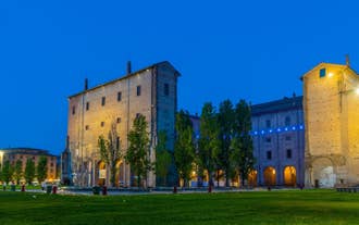 Photo of panorama of Parma cathedral with Baptistery leaning tower on the central square in Parma town in Italy.