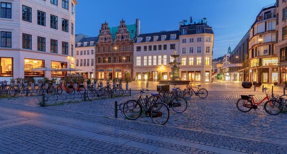 Photo of Stork Fountain on the Amagertorv (Amager Square) and the longest pedestrian street in the world Stroget in Copenhagen, Denmark.
