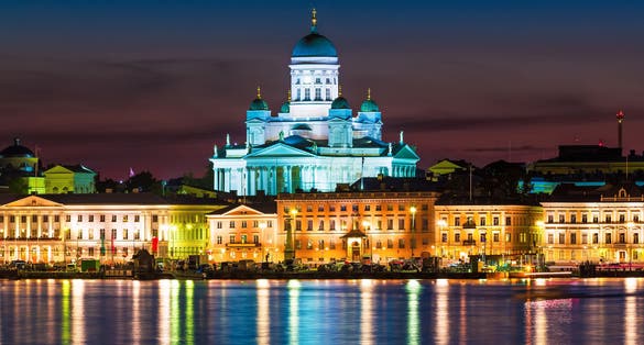 Photo of scenic night view of Market Square and Lutheran Christian Cathedral Church at the Senate Square in Helsinki, Finland.