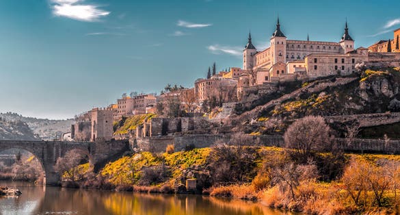 photo of view of View from the Tagus river towards the historical center of Toledo, Spain.