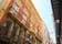 Photo of Looking up at the beautiful buildings & architecture lining La Calle Mayor. The street connects Plaza de España with the port with little shops, bars and restaurants. Cartagena, Murcia, Spain.