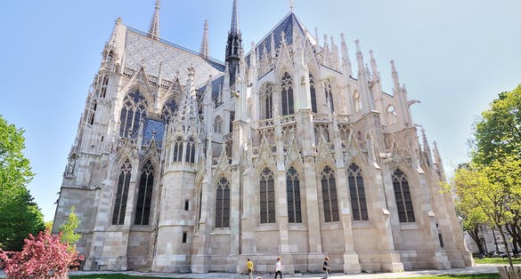 photo of view of Votive Church (Votivkirche) is a neo-Gothic church located on the Ringstrasse in Vienna, Austria.