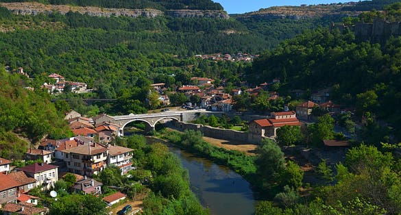 Photo of cityscape from hill Tsarevets, view of the Yantra river and the Church of The Forty Holy Martyrs in Veliko Tarnovo Bulgaria.