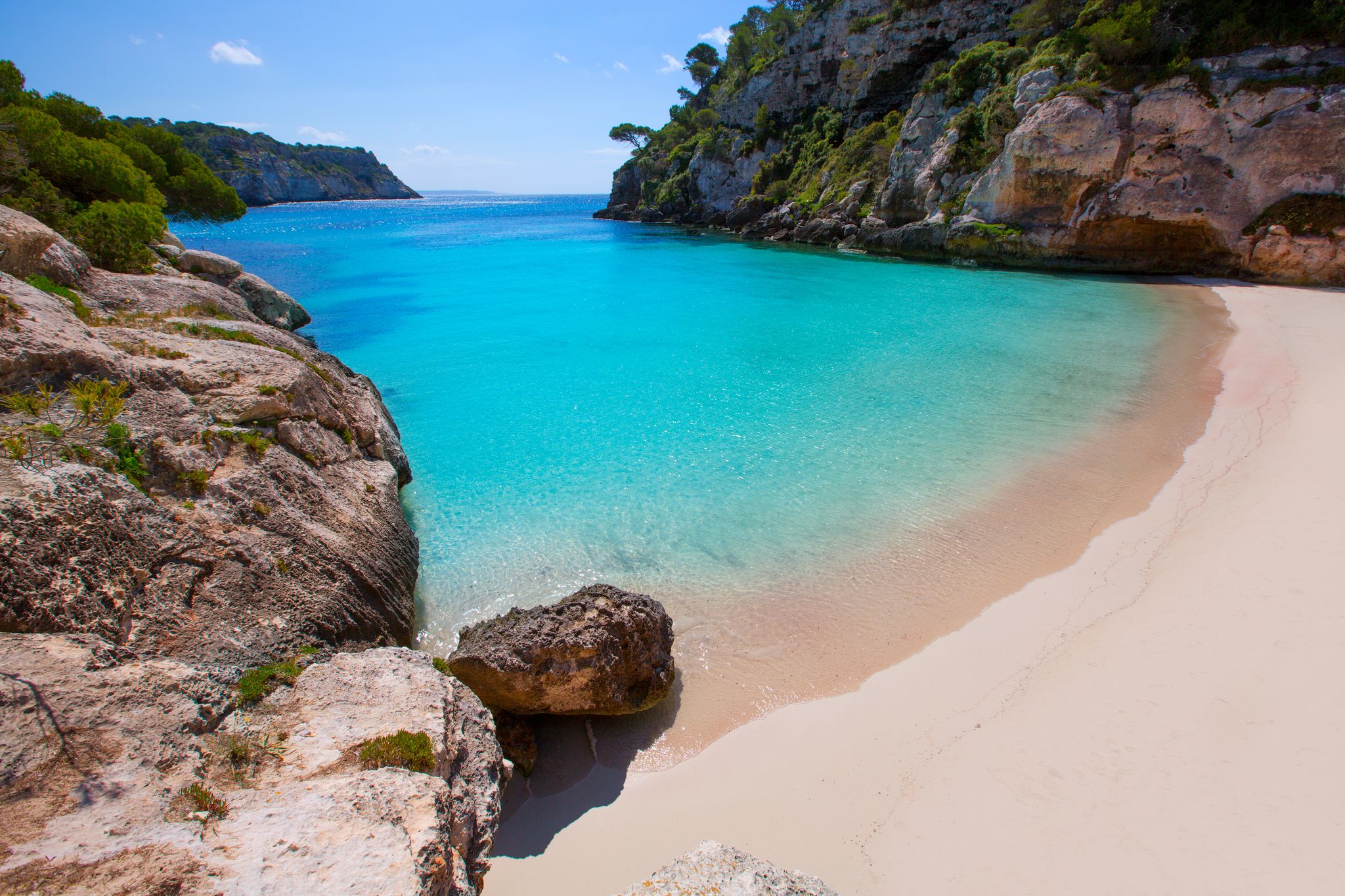 Photo of Cala Macarelleta in Ciutadella Menorca at turquoise Balearic Islands, Spain.