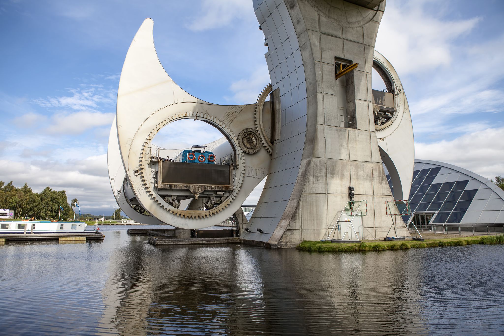 The Falkirk Wheel is a rotating boat lift in Falkirk, Scotland, connecting the Forth and Clyde Canal with the Union Canal.