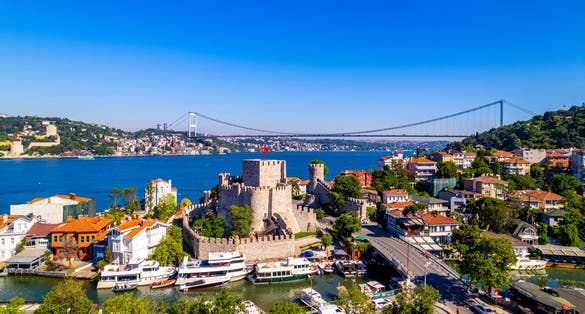 Fatih Sultan Mehmet Bridge and Anadolu Hisari (Anatolian Fortress) in Istanbul, Turkey. Beautiful Istanbul bosphorus landscape. Drone shot.