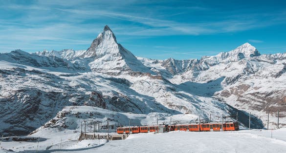 photo of Matterhorn, Switzerland, Winter tourist train with Matterhorn mountain in the background, Zermatt.