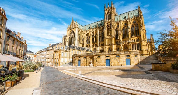 Photo of street view on the central square with famous cathedral in Metz city in Lorraine region of France.