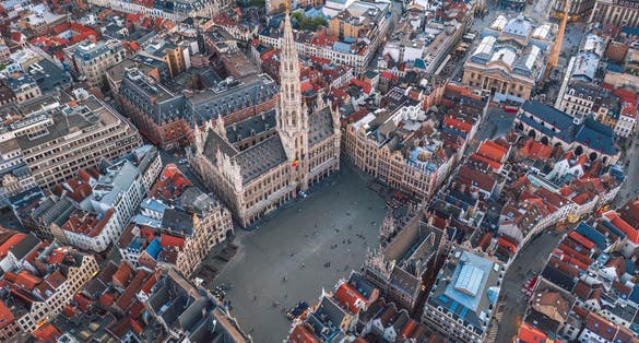 Photo of aerial view of Grand Place square and Town Hall (Hôtel de Ville de Bruxelles). Sunset cityscape of the City of Brussels, Belgium.