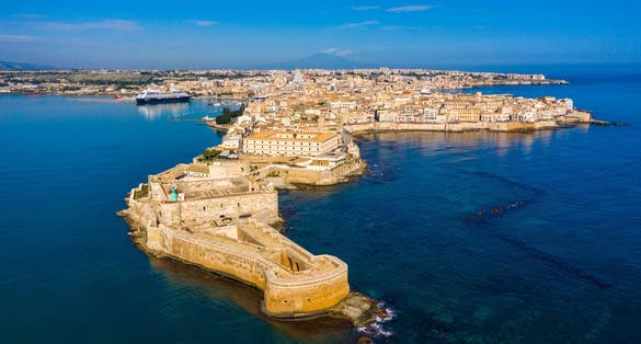 Photo of aerial view of coastline town Syracuse, Sicily and old Ortigia island. 