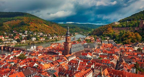 photo of view of Aerial view of landmark and beautiful Heidelberg city with Neckar river, Germany. Heidelberg town with the famous Karl Theodor old bridge and Heidelberg castle.
