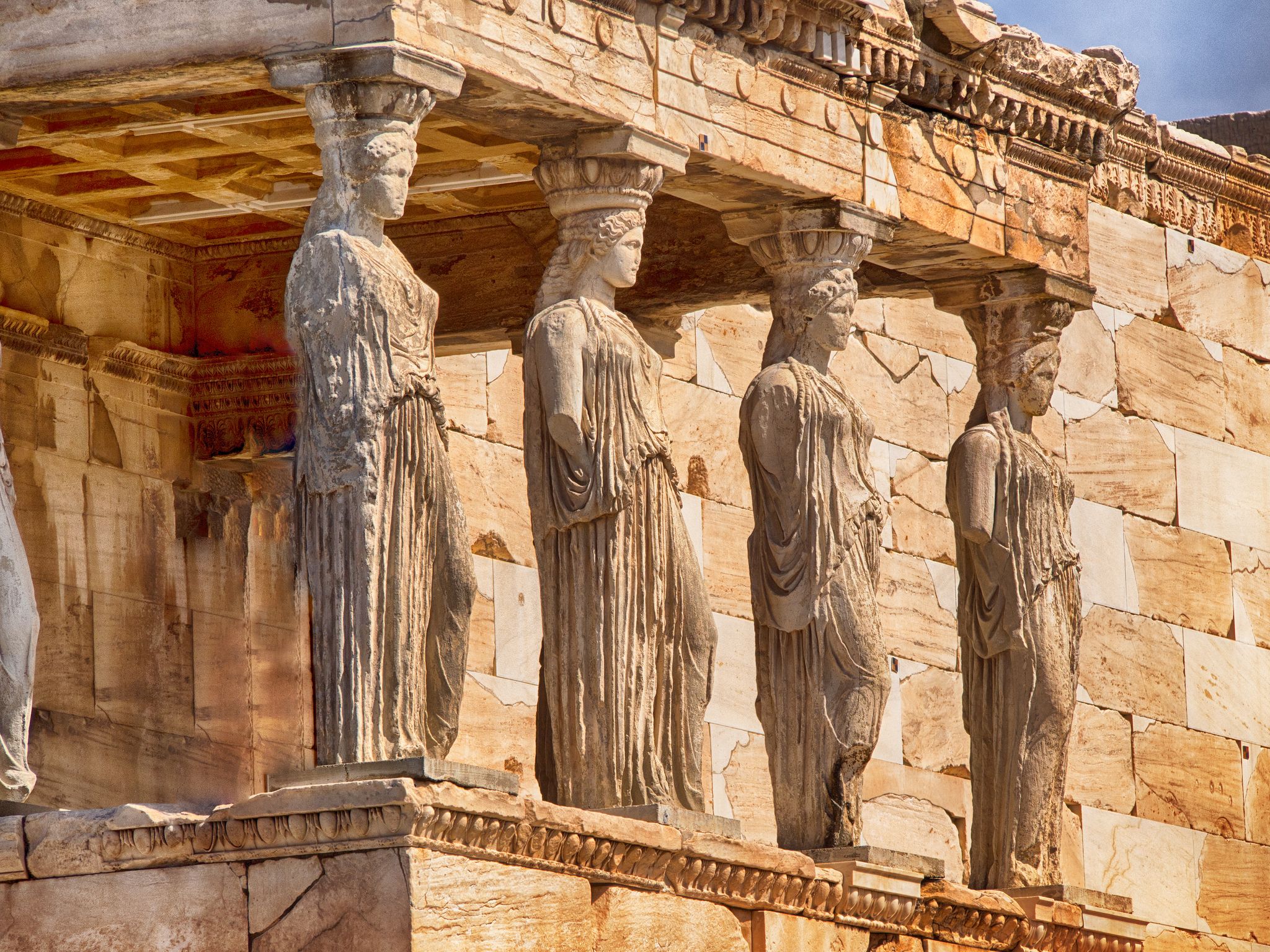 Photo of detail of caryatids statues on the Parthenon on Acropolis Hill, Athens, Greece.