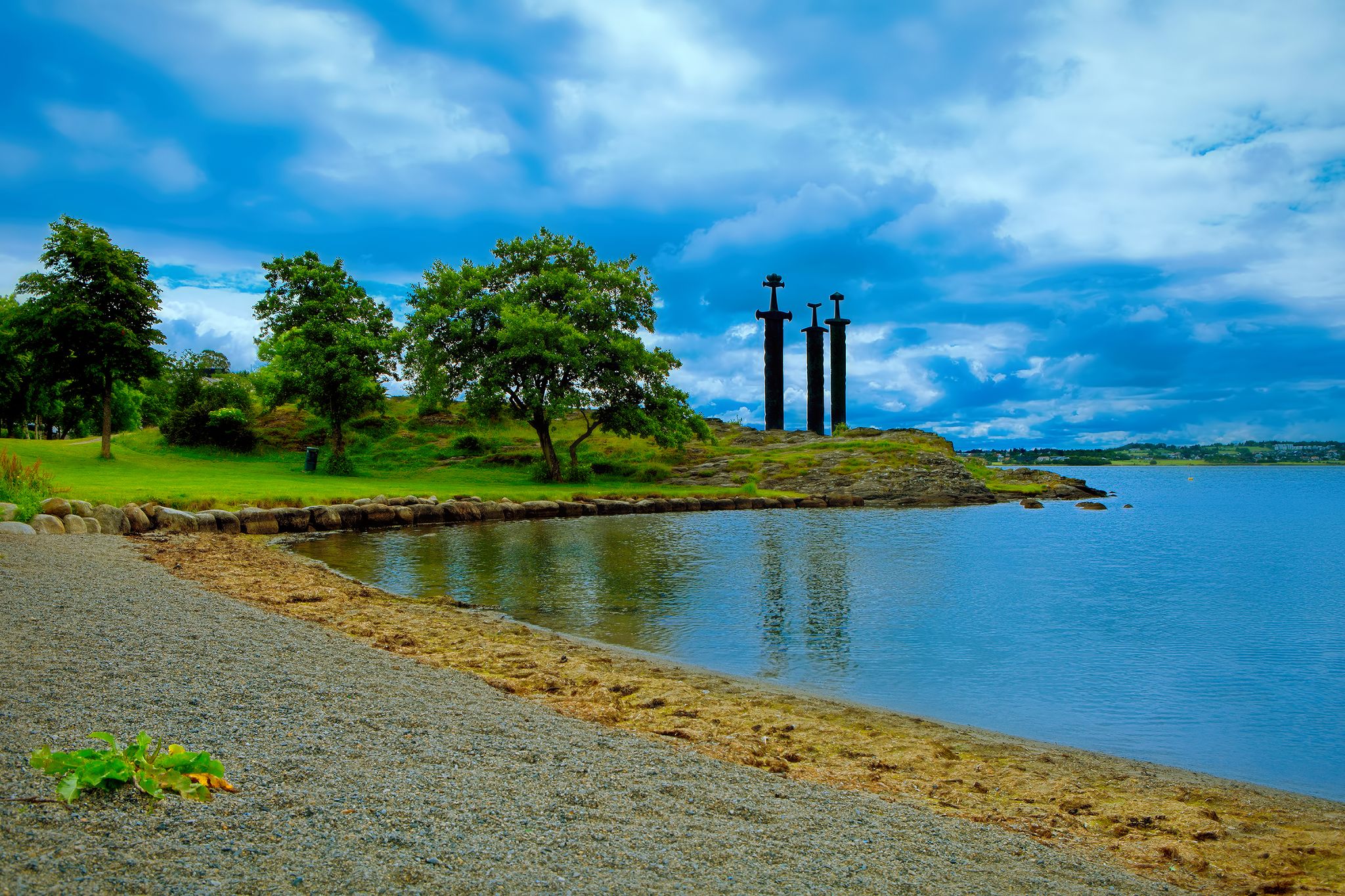 Photo of aerial view of three large swords Sverd i Fjell stand on the hill as a memory to the Battle of Hafrsfjord in year 872 in Stavanger, Norway.