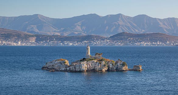 photo of Lighthouse on small island in the sea near Igoumenitsa, Greece.