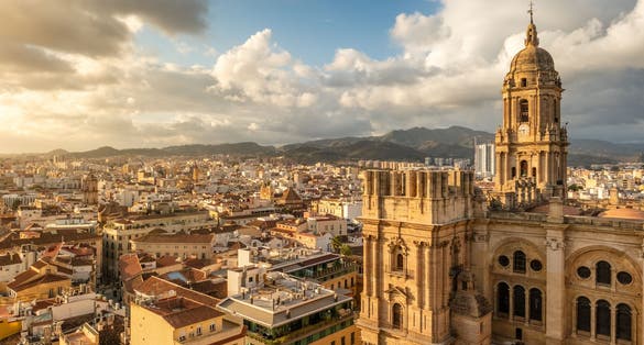 Photo of Malaga cityscape with beautiful Cathedral of the incarnation at sunset, Spain. Malaga old town, Cathedral and skyline of the city.