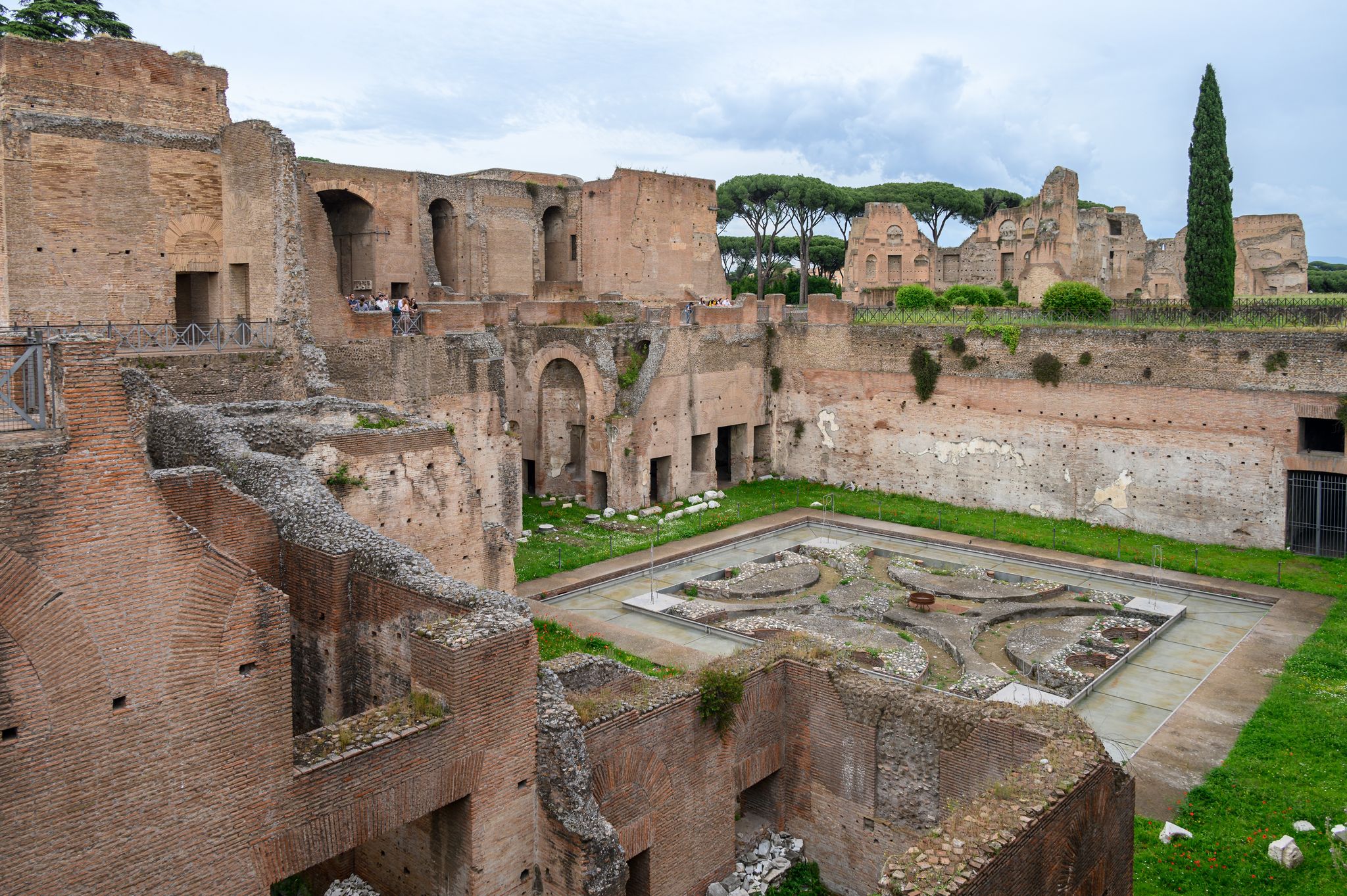House of Augustus on Palatine Hill, Rome, Italy. Famous Palatine is tourist attraction of Rome. Ancient Roman buildings and ruins on Palatine top in summer. Theme of old palace, travel and tourism.