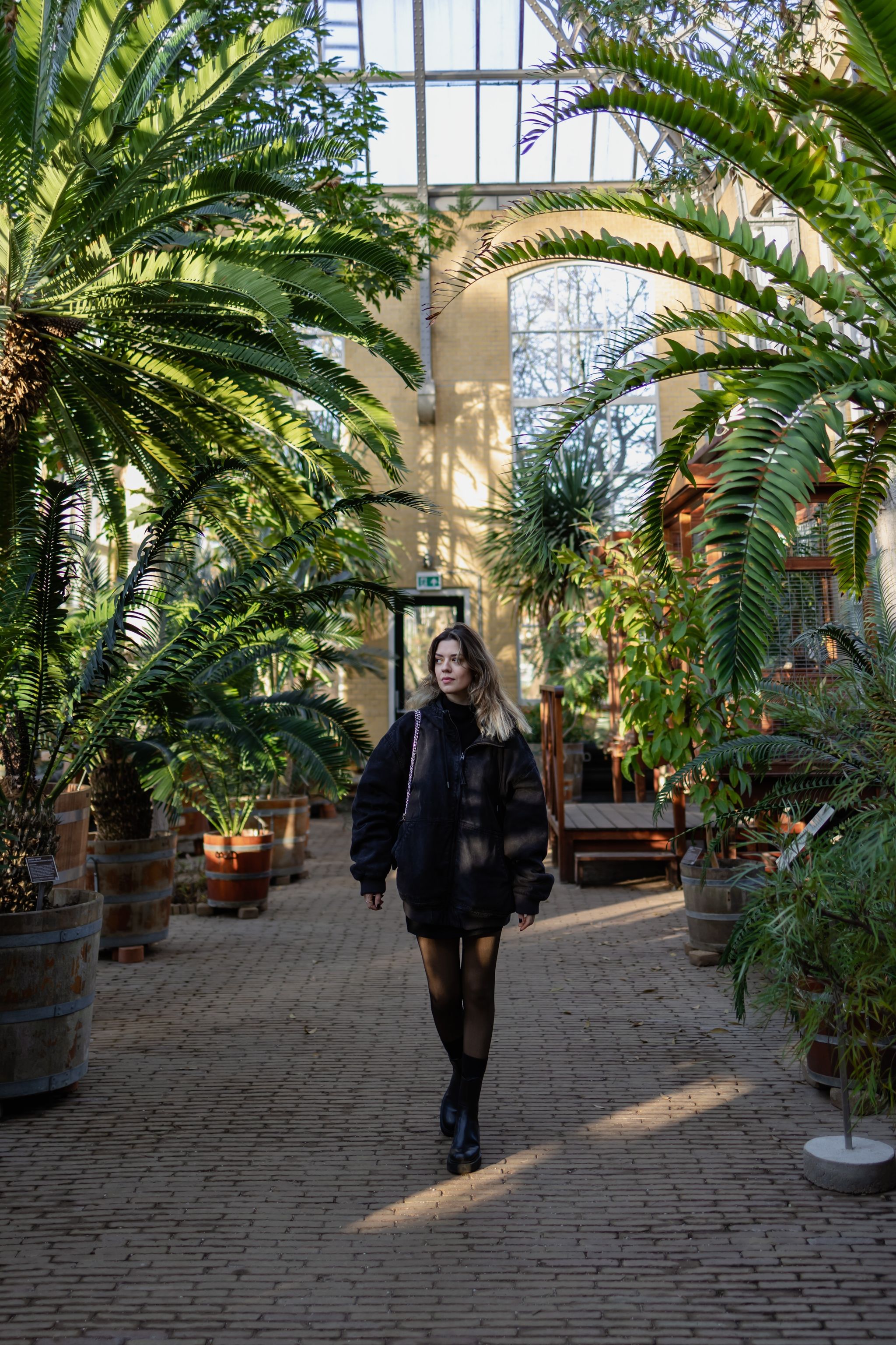 photo of young woman in Hortus Botanicus in Amsterdam, Netherlands.