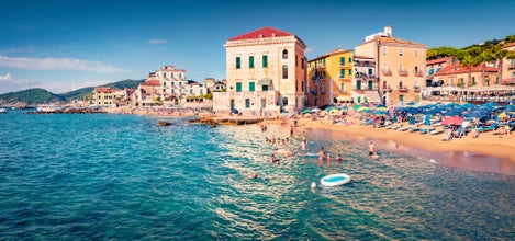 Hot summer day on Santa Maria di Castellabate puclic beach. Picturesque outdoor scene of Italy, Europe. Vacation concept background.