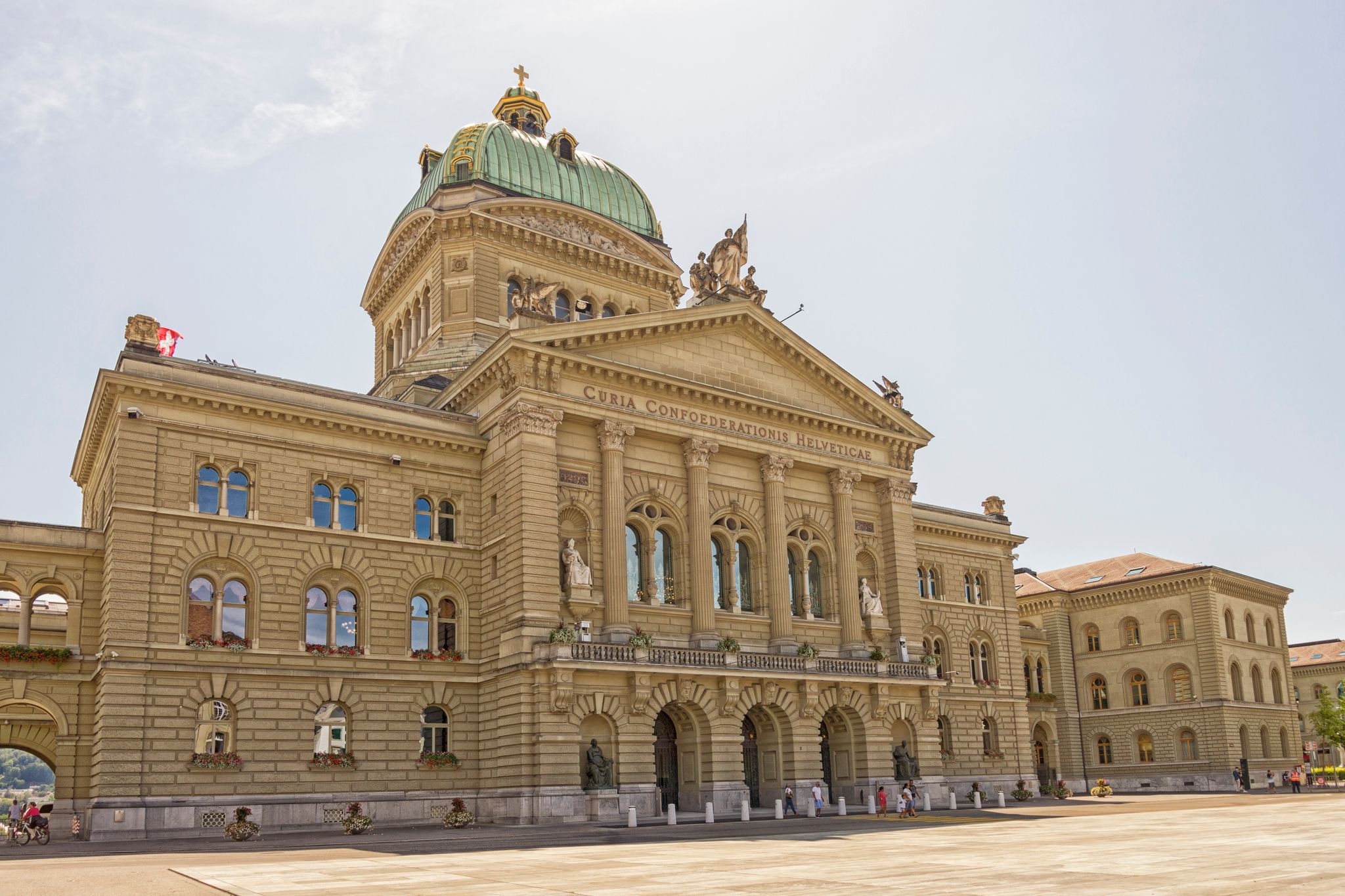 photo of people visiting Bundesplatz the Swiss Capital Building in Bern, Switzerland.