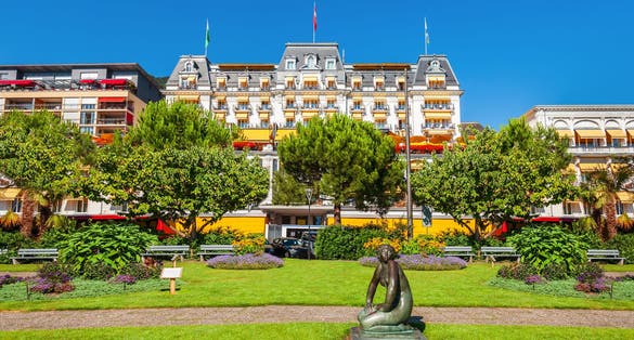 Public park in Montreux. Montreux is a town on the shoreline of Lake Geneva at the foot of the Alps in Switzerland