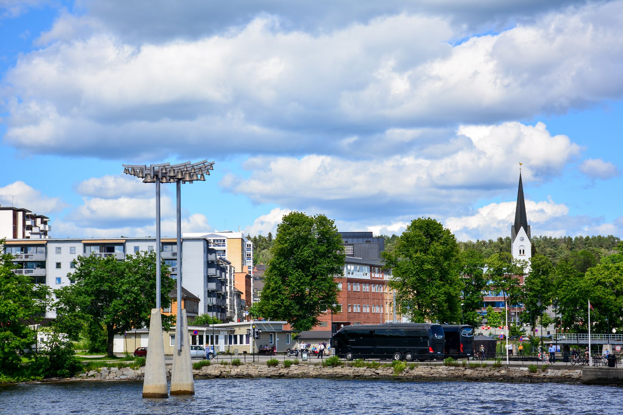 photo of view of View of the port of Hamar, Norway, from Lake Mjosa with the Bell tower and the tower of Hamar Cathedral. Hamar is a small town in Innlandet, formerly Hedmark, county.
