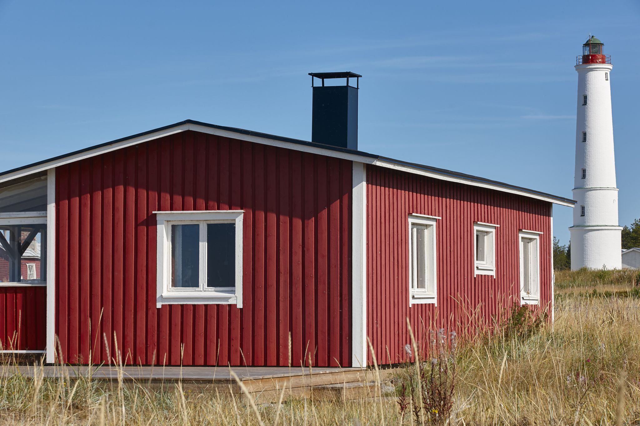 Photo of Marjaniemi lighthouse with red cabin, Denmark.