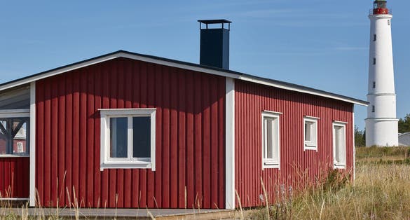 Photo of Marjaniemi lighthouse with red cabin, Denmark.