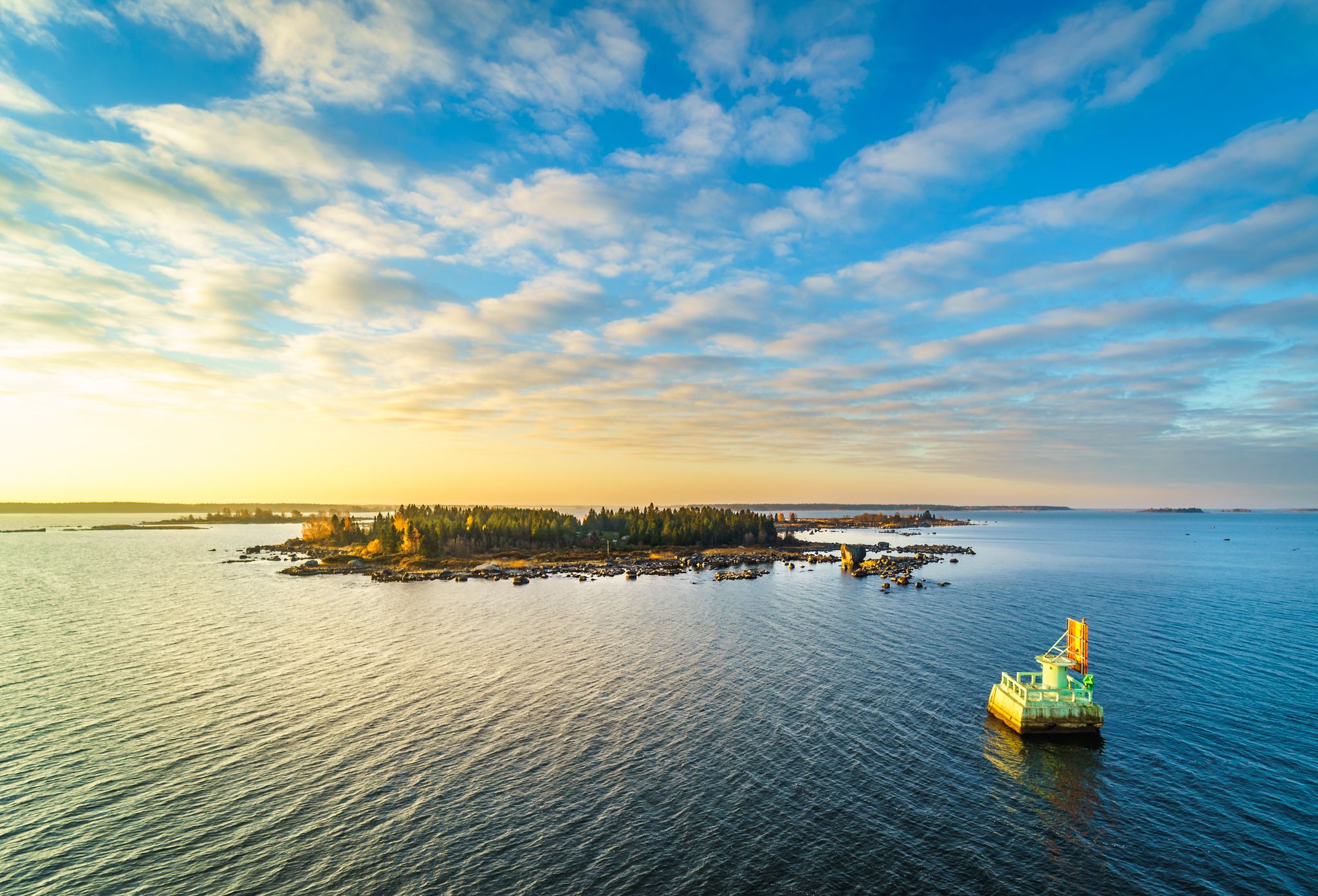 Beautiful sunrise scenery of an island in the Finnish archipelago in Vaasa, Shot from the Ferry connection between Vaasa and Umea.
