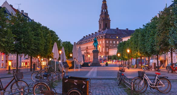 Photo of Christiansborg Palace during morning blue hour, Copenhagen, capital of Denmark.